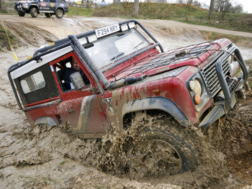 A landrover in action on the off-roading track at Wildtracks.