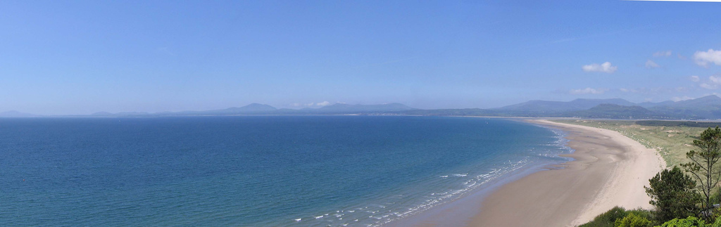 A cliff-top view of Cardigan Bay beach.